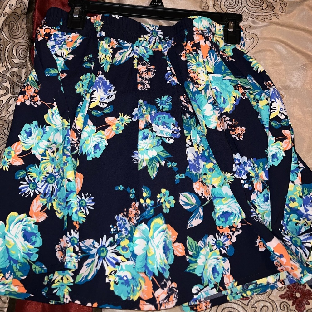 Cute, navy blue, short skirt with flowers